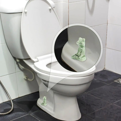 Kick Up Your Bathroom Style With These Pretty Dang Cute Ceramic Frog Toilet Bolt Cover Set Featuring Sturdy Tank Caps And Whimsical Hardware Accessories - close-up of glazed green frog cover on toilet.