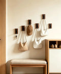 Heavy Duty Eight Piece Walnut Wood Wall Hooks Featuring Thickened Aluminum Support With Upward Non Slip Bend coat rack for hats and bags.