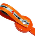 Close-up of orange two-piece C CLINK lockout key with magnetic strap for UFP surge brakes on a boat trailer