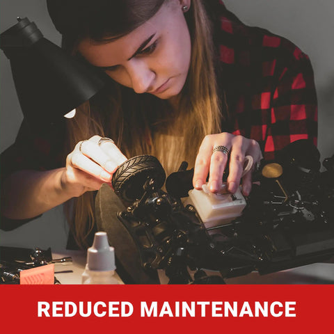 Person assembling RC10 SC6.1 model with FastEddy Bearings for reduced maintenance.