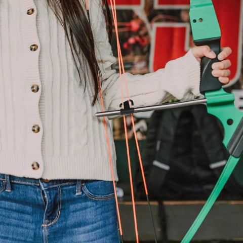 Close-up of archery bow with Cable Slide Block Replacement Accessory Durable Plastic Bowstring Separator Splitter Roller Glide in use