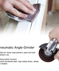 Rock Solid 4 Inch Pneumatic Air Angle Grinder With 11000 RPM Power And Heavy Duty Aluminum Housing Featuring A Secure Locking Switch For Knockout Wall Sanding Painting And Home Decor Tasks in use on surface.