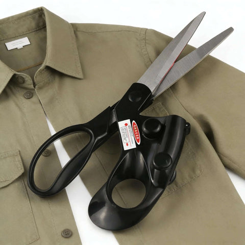 Angled side view of professional laser-guided fabric scissors with ergonomic black handle and long steel blades