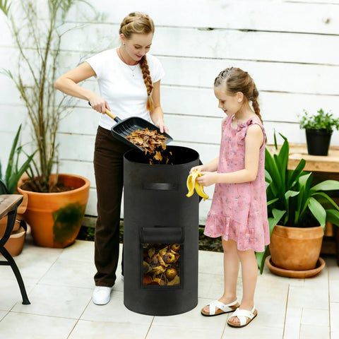 Woman and child using a 34 Gallon Outdoor Compost Bin With Handles And Observation Windows, Thickened Breathable Foldable Design