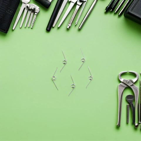 Yardwe 16pcs Premium Trash Can Torsion Spring Replacement Kit For Kitchen Bin Lid Fix With Card Slot And Foot Pedal Integration Durable Silver Metal Parts For Quick Diy Repair And Home Upgrades, silver torsion springs on green background