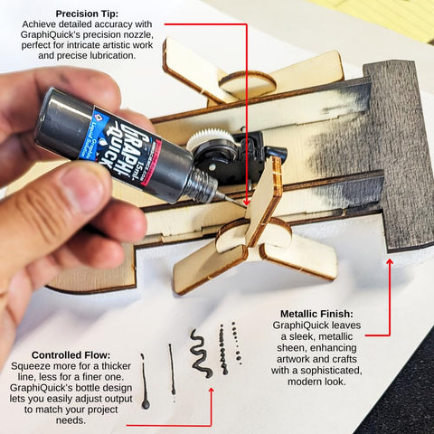 Person using GraphiQuick Liquid Graphite Lubricant And Craft Enhancer With Precision Nozzle for precise detailing and metallic finish.