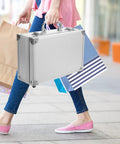 Badass Silver Aluminum Alloy Toolbox Organizer With Ergonomic Carry Handle carried alongside shopping bags.