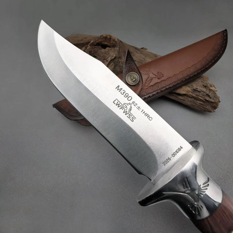 Close-up of M390 Fixed Blade Hunting Knife With Wood Handle Full Tang Survival Knife Leather Sheath Built For Rugged Outdoor Camping Bushcraft And Beast Mode Wilderness Tasks No Cap, showing blade engraving and leather sheath.