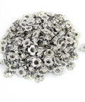 Top Shelf M8 Four Pronged Tee Nuts With Secure Captive Blind Grip For Straight Up Wood Furniture Assembly 200 Pack Carbon Steel Blind Inserts piled together.