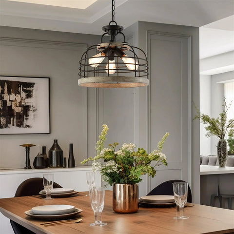Industrial Farmhouse 17 Inch 3 Light Pendant Chandelier With Cage Shade Convertible Semi Flush Ceiling Light In Rustic Cedar Wood And Coarse Black Finish With Bold Vibe hanging over dining table.