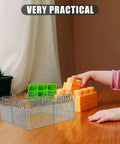Slick Light Gray Plastic Miniature Fence Kit With Dead Simple Snap Together Design For Farm Diorama And Prison Model Builds A Top Notch DIY Playset arranged with colorful blocks on a wooden table.