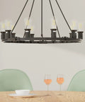 Dope Large Wagon Wheel Chandelier With Ten Lights in black rustic farmhouse style hanging over dining table