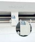 Top Tier Crafting Kit Featuring Two Replacement Blades Durable Housing And Foil Transfer Tip Designed For Electronic Vinyl Cutters Giving You A Serious Upgrade On Cardstock Stickers And Paper That Is A Total Game Changer - Close-up of blade housing on a Cricut Joy Xtra machine.