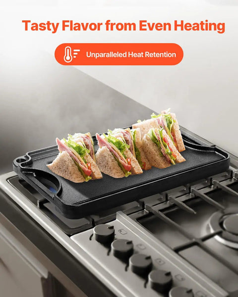 Reversible Cast Iron Grill And Griddle Pan Fourteen By Eight And A Half Inch preheating with sandwiches on stovetop