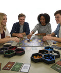Group playing board game with Hexagonal Magnetic Board Game Tray Organizer Set With Flexible Layouts 7 Pack in a sleek black finish
