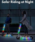 Two people riding scooters with LED Light Kit For Scooters With Multi Color LEDs, Lighting Modes, And App Control at night