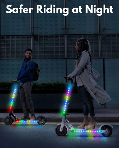 Two people riding scooters with LED Light Kit For Scooters With Multi Color LEDs, Lighting Modes, And App Control at night