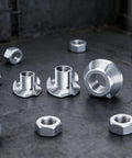Bulk Pack 210 Units 1 Quarter 20 T Nut Fasteners Coated Four Point Attachments on metal surface