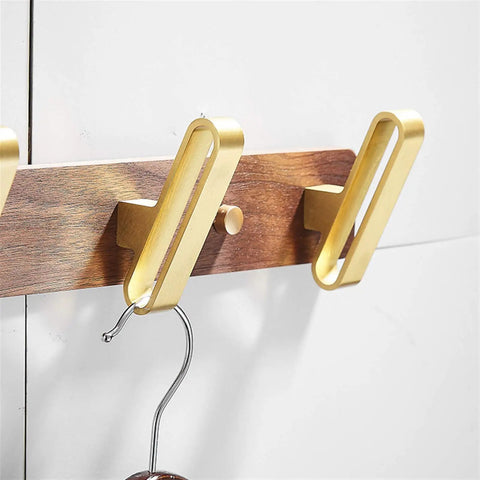 Slick Wall Mounted Solid Wood Double Coat Hook With Brushed Gold Finish, designed for hanging coats and bags in entryways.