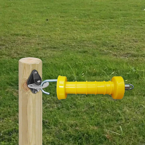 High Visibility Electric Fence Gate Handle Kit with one yellow handle attached to a wooden post in a field