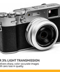 Fujifilm X100 series camera fitted with NC UV Silver Frame Lens Protector Filter, showcasing 99.3% light transmission feature.