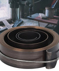 Chrome Plated Drill Press Return Spring for Quill Replacement Coil for Bench Drills Horizontal and Vertical Machines, Spring Steel Build Delivers Reliable Beefy Retraction and Consistent Top Position displayed on a workbench.