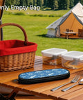 Blue Dinosaur Themed Portable Utensil Kit with Zipper Pouch Reusable Storage Case for Desert Camping on picnic table