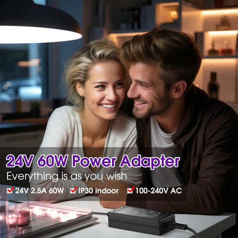 Couple smiling with 24V 60W Power Supply Adapter, 5.5 x 2.1mm DC Plug on table, UL Listed AC to DC converter for LED strip lights.