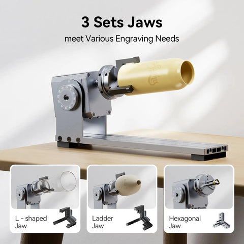 3 In 1 Laser Rotary Attachment For Engraving Cylindrical Objects Like Wine Glasses Tumblers Mugs And Rings on a table with jaws.