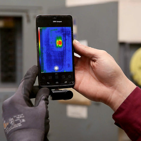 Compact All Purpose Thermal Imaging Camera For Android USB C Turns Your Phone Into A Real World Thermal Cam For Home Jobsite And More Spot Energy Loss Electrical And Mechanical Faults Water Damage And Hidden Issues attached to a phone in use