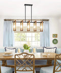 Farmhouse Gold Solid Wood Five Light Chandelier With Black Metal Frame For Kitchen Island Vibe Entryway Dining Room And Bedroom Lighting Rustic Modern Style Easy Hardwired Ceiling Mount LED Ready With E26 Bulbs in a dining room setting