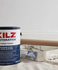 Restoration Primer Interior Sealer And Stainblocker, Water Based, 1 Gallon can with paint tray and paper roll on canvas