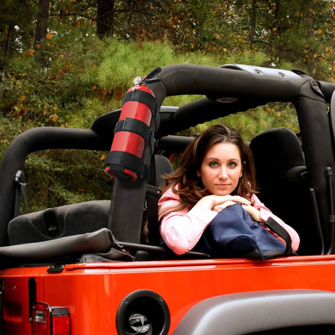 Jeep Fire Extinguisher Mount Holder With Roll Bar Strap Non Slip Carrier For Wrangler Third Party Accessory visible in vehicle