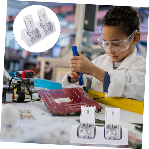 Child working on circuit board next to Dual Slot Controller Battery Charger Dock with USB Cable White Durable Charging Station for Rechargeable Batteries Easy Accessory for Gamers and Console Setup