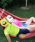 Extra Large Double Hammock For Two With 330cm Total Length And 500lb Capacity Canvas Cotton Super Comfy Outdoor Living For Patio Porch Garden Outdoor Indoor Rainbow XXL in use