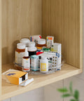 4 Pack Lazy Susan Organizer Set with 12 Inch High Edge Turntable holding medicine bottles in a wooden kitchen cabinet