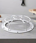 Tough As Nails Smoke Sensor Protective Cage With Heavy Duty Vandal Resistant Fire Alarm Sprinkler Cover on a workbench.