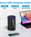 A Dead Simple Heavy Duty 6Ft Power Strip Tower Surge Protector With 16 Broad Spaced Ac Sockets And Five Quick Usb C Charging Ports For Dodging Cable Chaos In Your Home Office Today on a desk with devices connected.