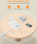 Clip On LED Reading Light for Bed with 36 LEDs illuminating books and phone on a wooden table, showing eye caring light features.