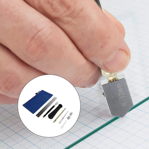 Hand using Pencil Style Glass Cutter Kit With 2 Spare Blades For Craft Projects And Window Glass Cutting Tools on glass