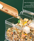 Clear Acrylic Hamster Pellet Feeder With Secure Cage Mount And Scatter Control Baffle, food being poured in.