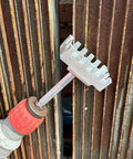 Manual hydraulic punch tool from Square Hole Cutter Kit For 86-Type Electrical Junction Boxes used on a metal surface