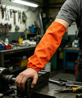 Wearing Badass Heat Resistant Welding Sleeves For Heavy Construction And Mechanic Work on arm while using machine.
