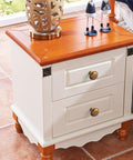 Antique Brass Cabinet Knobs 6 Pack Set on white dresser with wooden top, showcasing zinc alloy, vintage brass hardware.