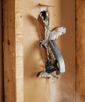 IsoCore Wrecking Bar And Crowbar With Board Bender tearing through drywall, demonstrating its prying and bending capabilities.