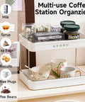 Coffee Bar Organizer Station With 2 Tier Mug Rack And Removable Drain Tray displayed with various coffees and teas.
