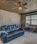 Room with copper faux tin PVC ceiling tiles 2x2 glue up, paintable tin look for quick DIY makeover, installed in a living area.