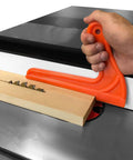 Hand using Orange Table Saw Push Sticks 4 Pack Must Have Safety Push Blocks With Magnetic Stick Function, Durable Plastic Woodworking Hand Tool For Carpentry Cutting And Shop Operation, Ergonomic Grip For Precise Control