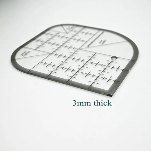 Clear Acrylic Quilting Ruler With Templates And Curved Corner Cutter, 6x6 inches, black edges, showing thickness of 3mm.