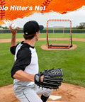 Portable Baseball Rebounder Net For Quick Pro Grade Returns With Four Adjustable Angles, 4 x 4.5 Ft, Orange on baseball field